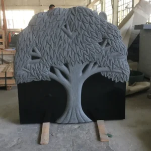 sculpted tree tombstone in deep black granite