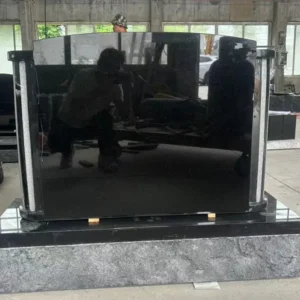 black symmetrical columnar upright gravestone